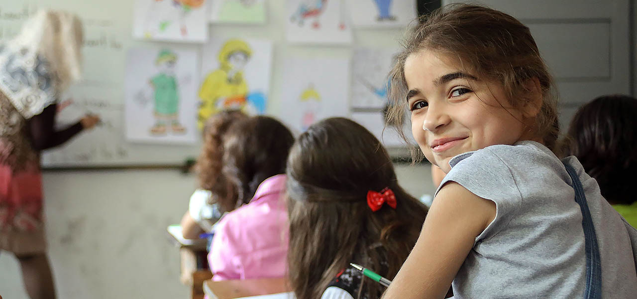 Smiling young girl in a classroom in Egypt. 